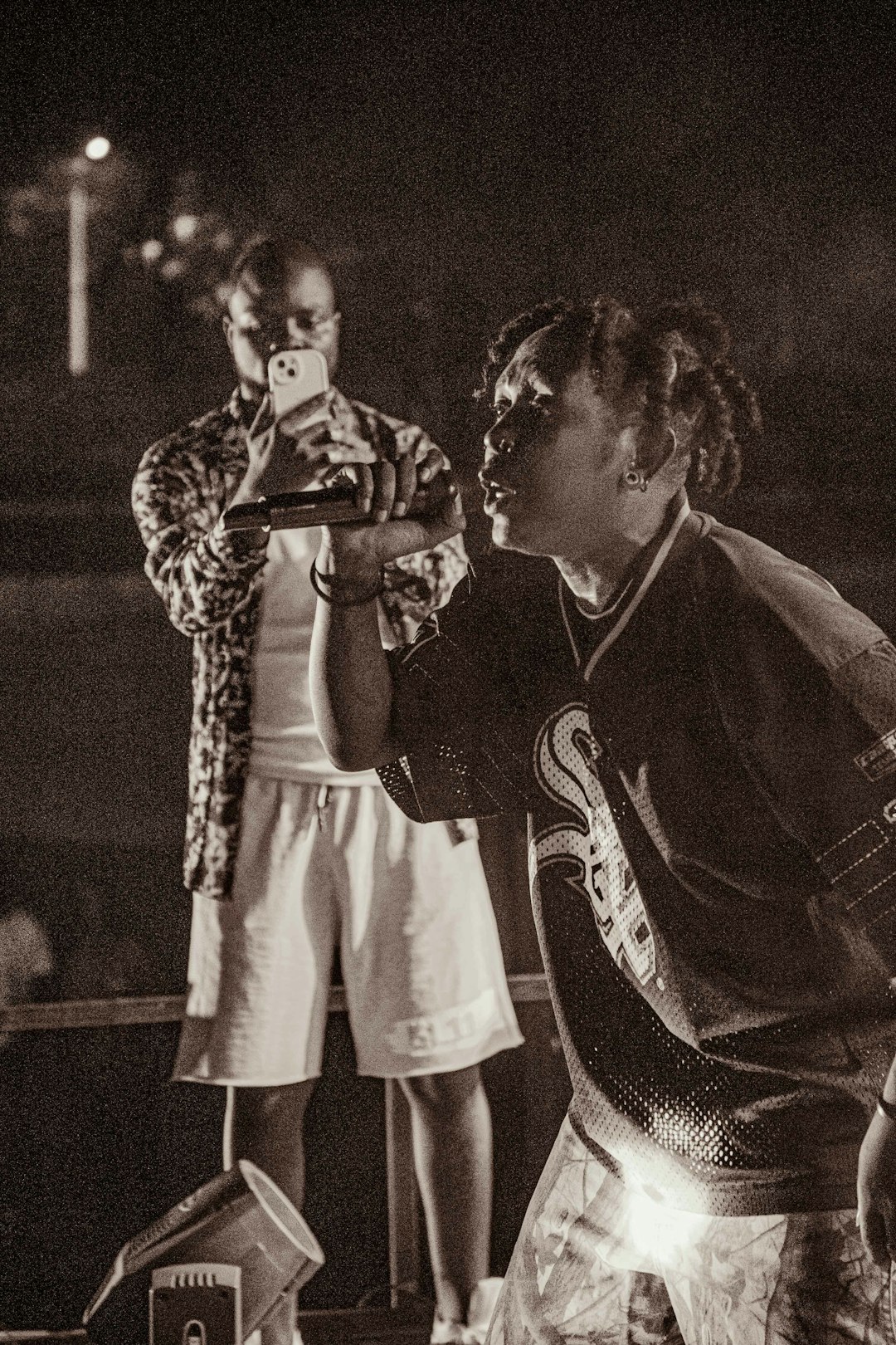 a-man-taking-a-picture-of-another-man-with-a-camera-sklfgtxpwus